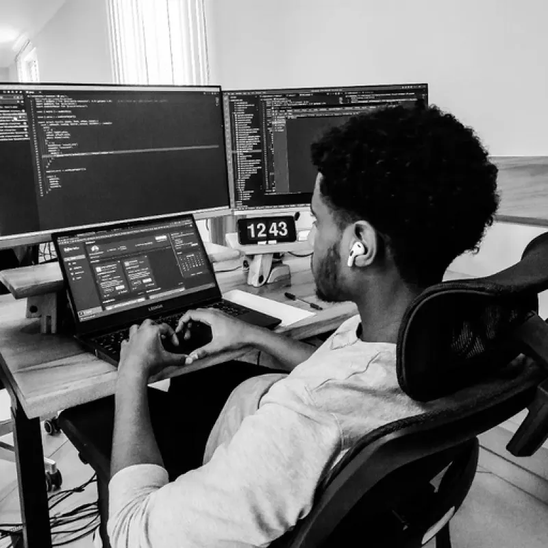Dagim working at his desk